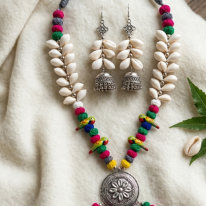 Handmade Kori Jewellery Set featuring natural shell accents, colorful thread beads, hand-painted parrot motifs, oxidised silver pendant, and matching jhumka earrings for Durga Puja and ethnic fashion.